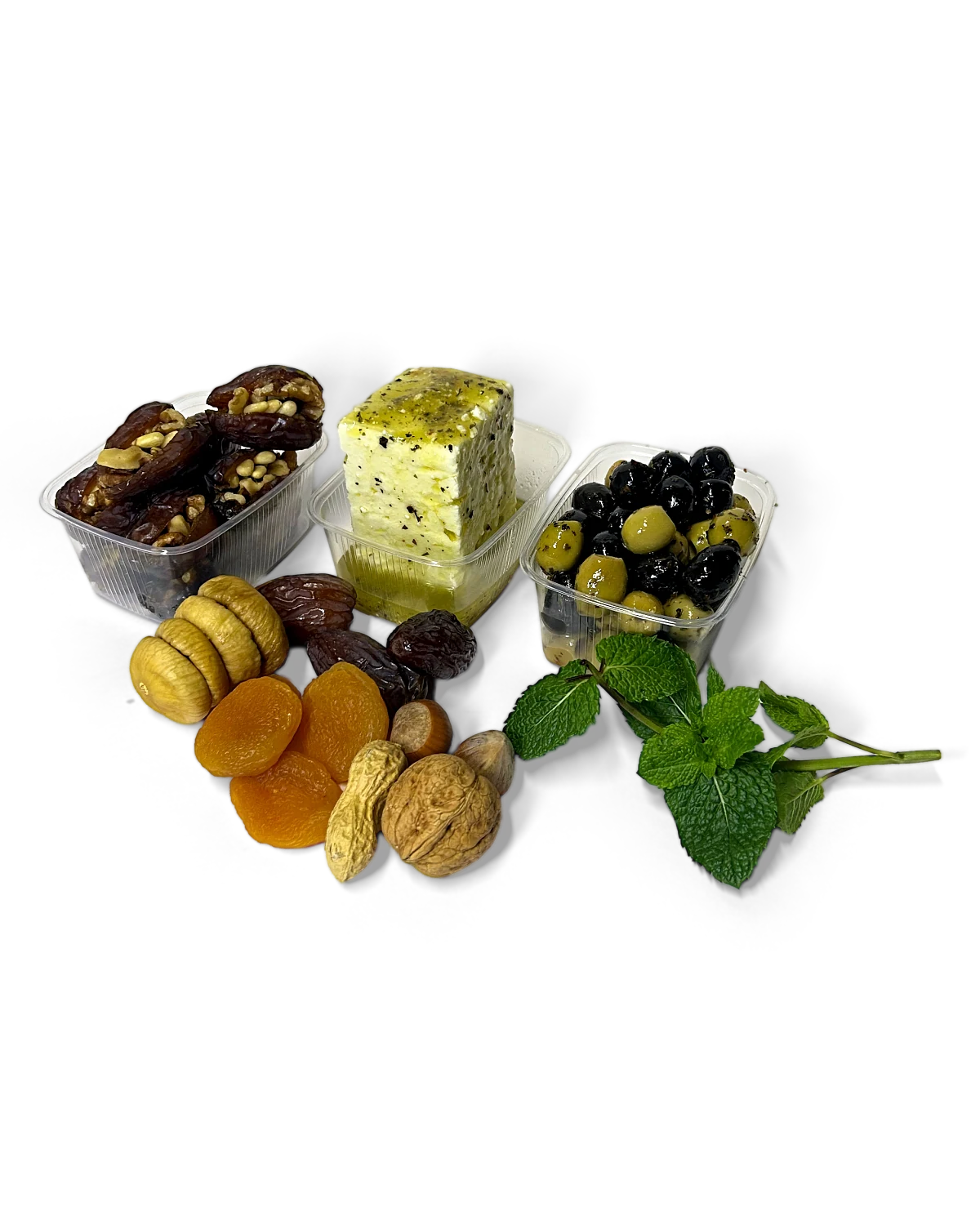Mit Walnüssen gefüllte Datteln, eingelegter Fetakäse mit Kräutern, Oliven, getrocknete Feigen und Aprikosen, Nüsse und Minze
