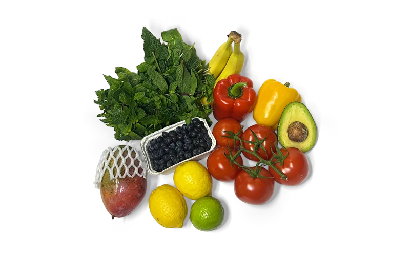 Frische Minze, Bananen, Paprika, Avocado, Tomaten, Heidelbeeren, Zitronen, Limette und Mango