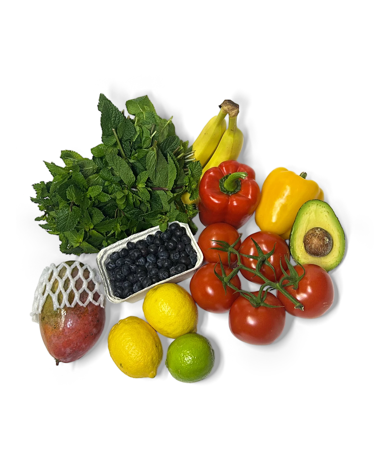 Frische Minze, Bananen, Paprika, Avocado, Tomaten, Heidelbeeren, Zitronen, Limette und Mango